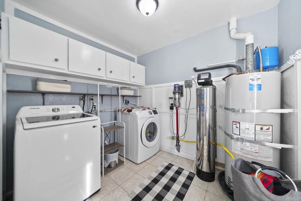 1569 Vía Monserate Fallbrook, CA 92028 - Photo 40 of 75 a utility room with dryer and washer