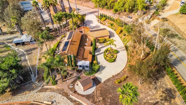a view of a swimming pool with lounge chairs