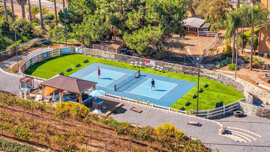 1569 Vía Monserate Fallbrook, CA 92028 - Photo 6 of 75 an aerial view of a house with a swimming pool