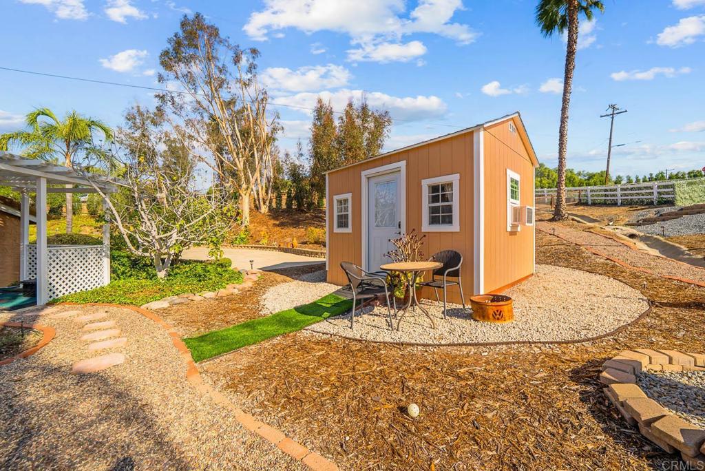 1569 Vía Monserate Fallbrook, CA 92028 - Photo 68 of 75 a view of a house with backyard porch and sitting area