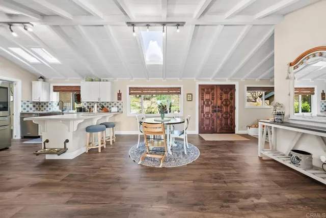 a kitchen with stainless steel appliances and stove top oven