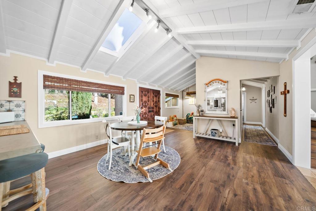 1569 Vía Monserate Fallbrook, CA 92028 - Photo 9 of 75 a living room with furniture a large window and wooden floor