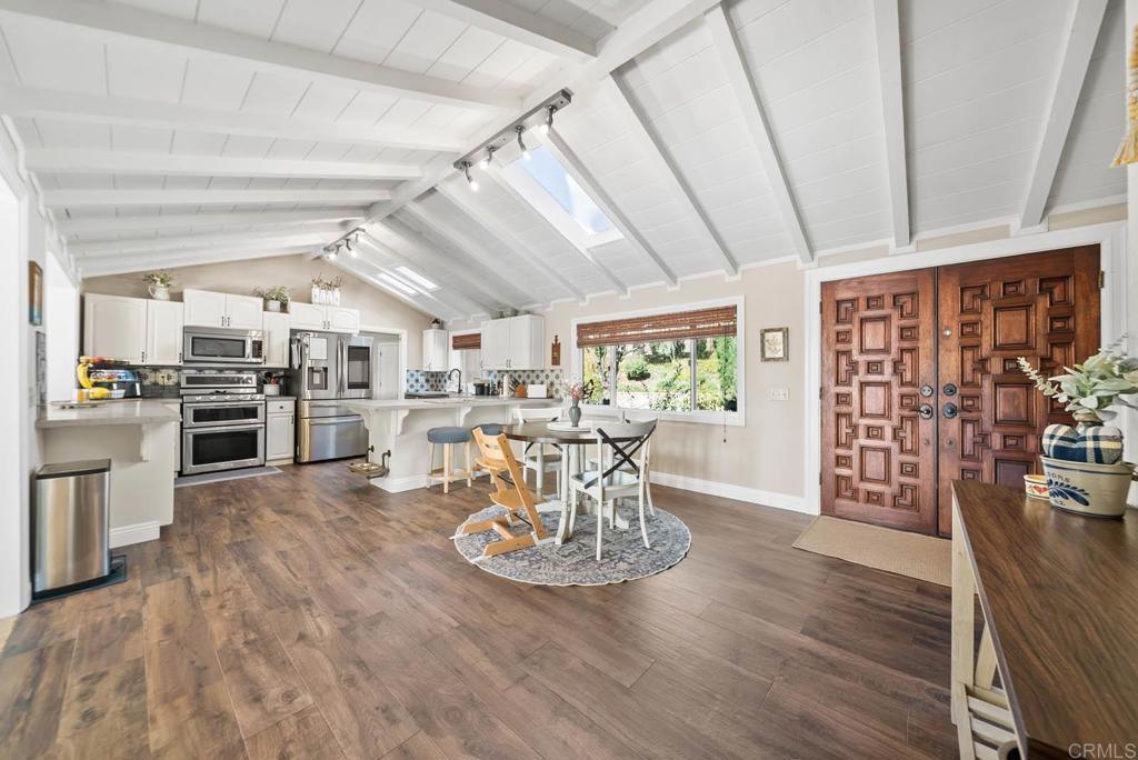 1569 Vía Monserate Fallbrook, CA 92028 - Photo 10 of 75 a view of a dining room with furniture window and wooden floor