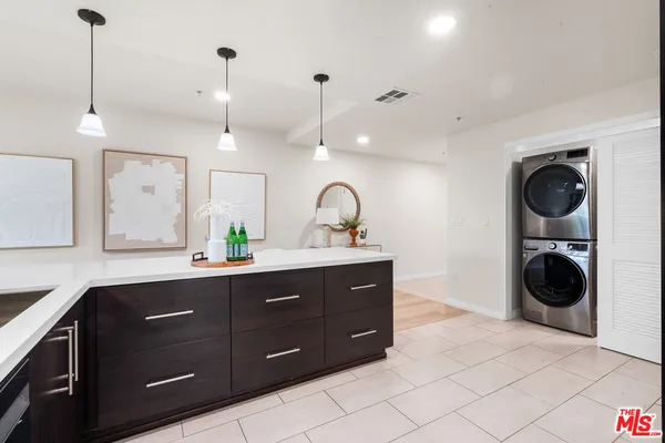 a spacious bathroom with a sink and a mirror