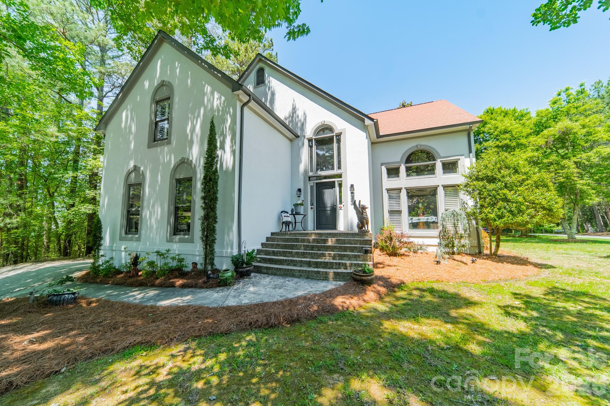 11043 Seven Coves Drive Tega Cay, SC 29708 - Photo 6 of 45 a front view of a house with a yard