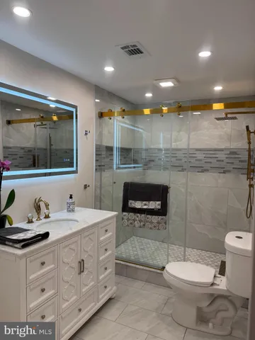 a view of a kitchen with wooden floor and a floor to ceiling window