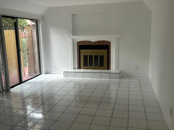 a kitchen with a cabinets and white appliances