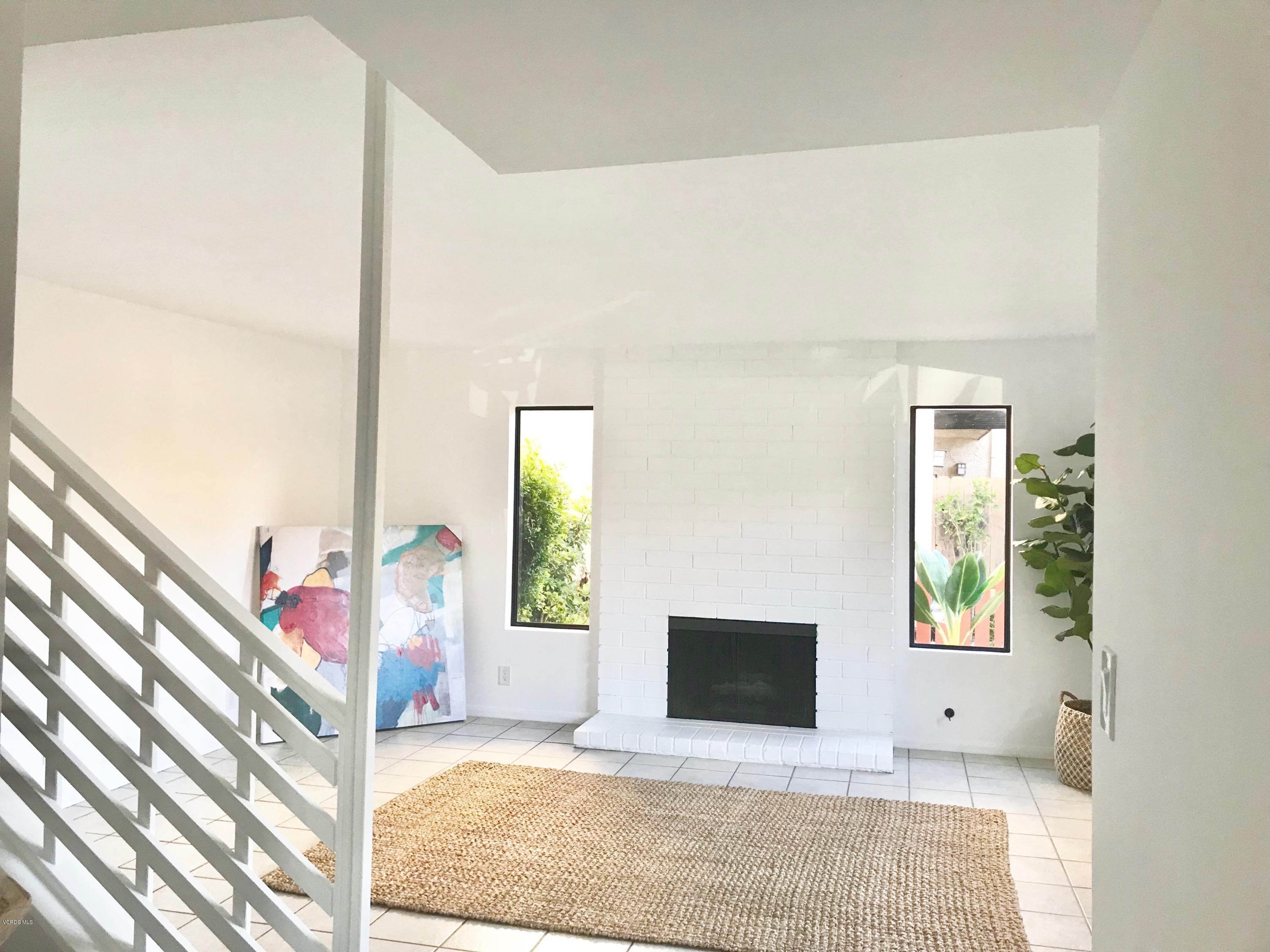 5205 West Wooley Road, Unit 1 Oxnard, CA 93035 - Photo 1 of 21 a view of an entryway with wooden floor