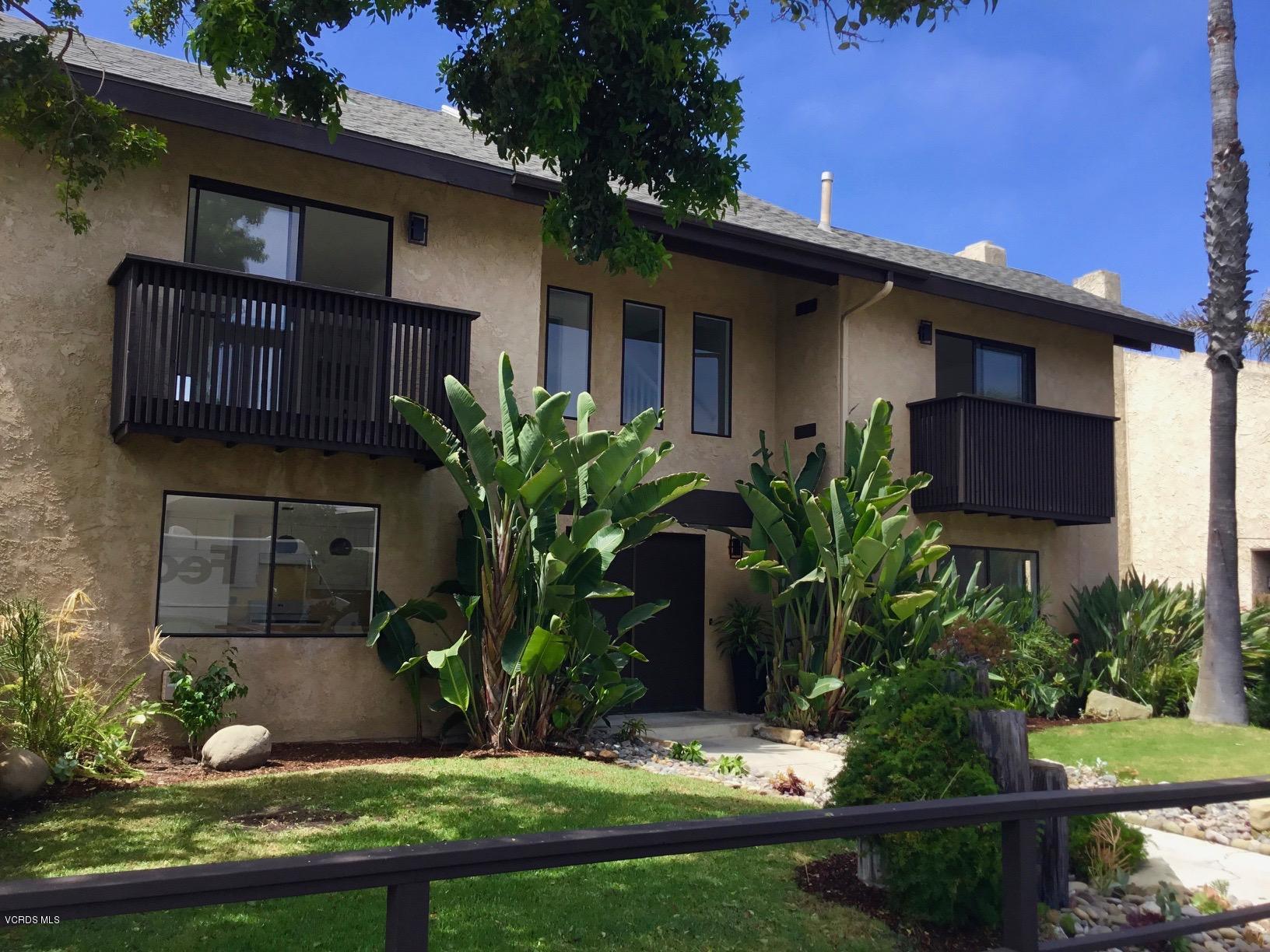 5205 West Wooley Road, Unit 1 Oxnard, CA 93035 - Photo 2 of 21 a front view of a house with a yard
