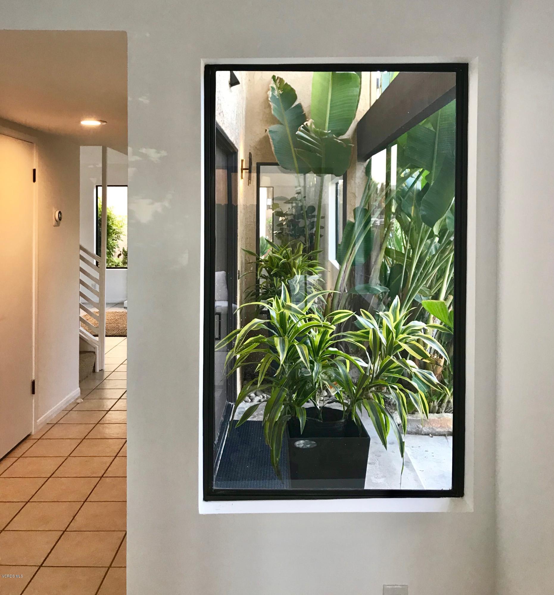 5205 West Wooley Road, Unit 1 Oxnard, CA 93035 - Photo 11 of 21 a picture of a glass door with a glass door