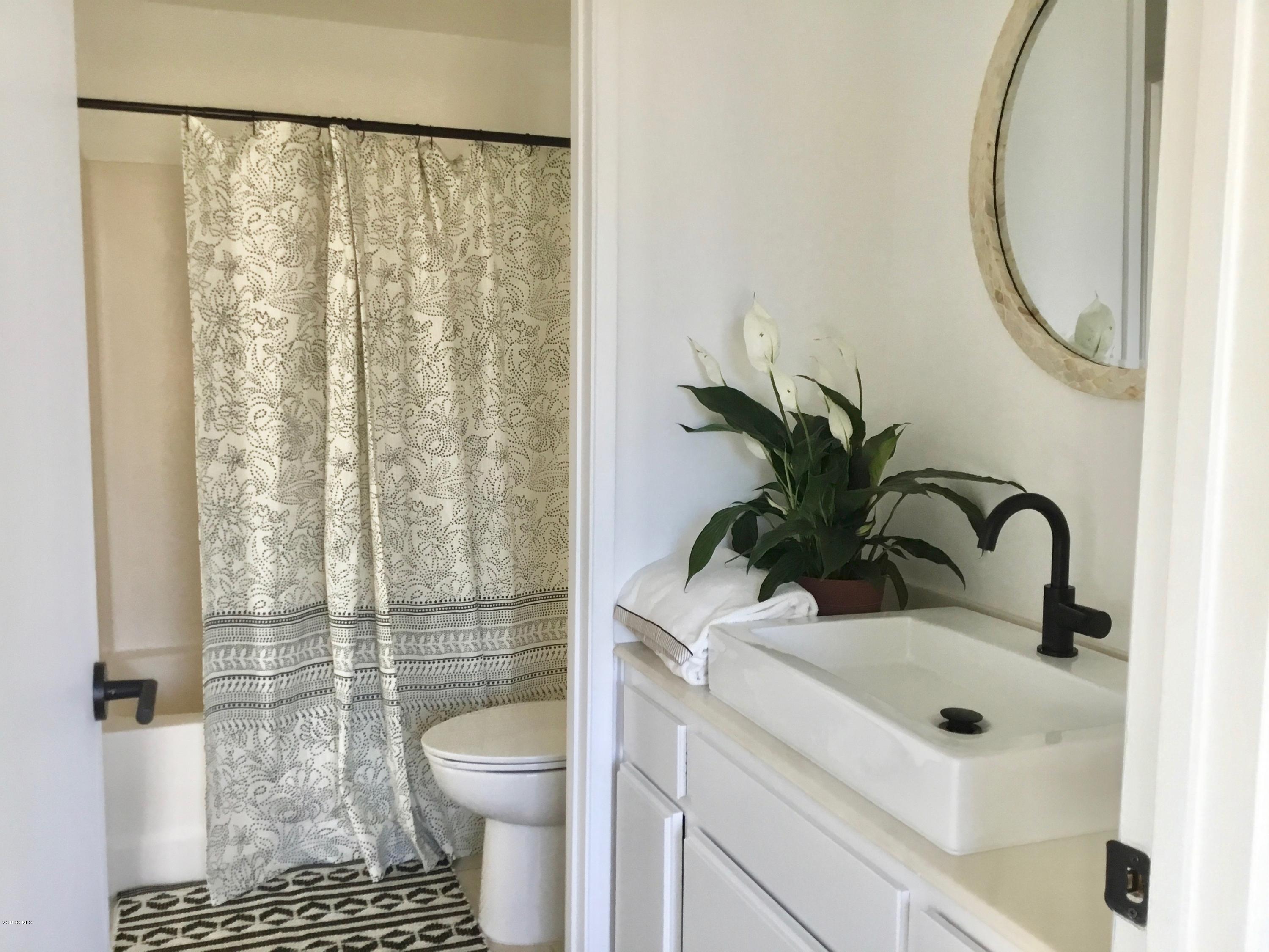 5205 West Wooley Road, Unit 1 Oxnard, CA 93035 - Photo 18 of 21 a bathroom with a sink toilet and shower