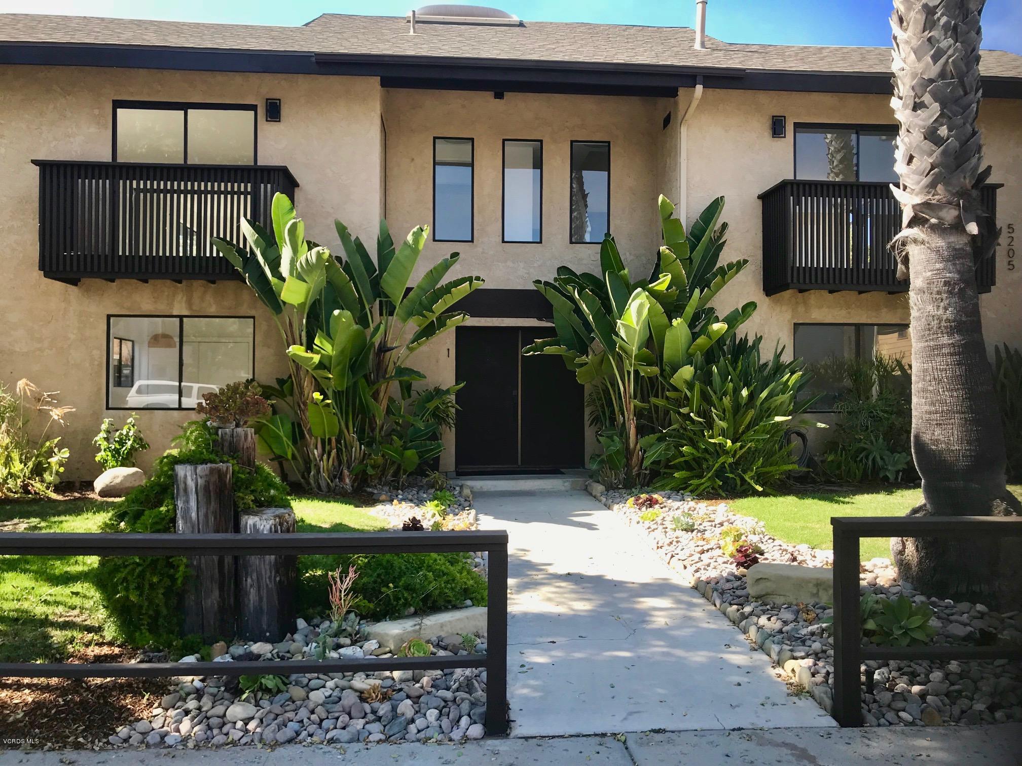 5205 West Wooley Road, Unit 1 Oxnard, CA 93035 - Photo 20 of 21 a front view of a house with a yard