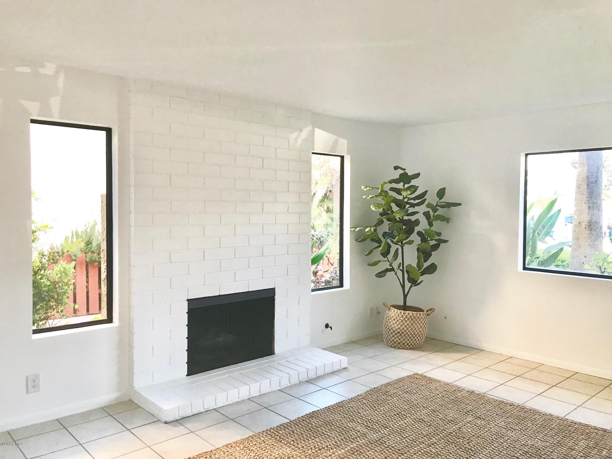 5205 West Wooley Road, Unit 1 Oxnard, CA 93035 - Photo 3 of 21 a living room with furniture and a potted plant