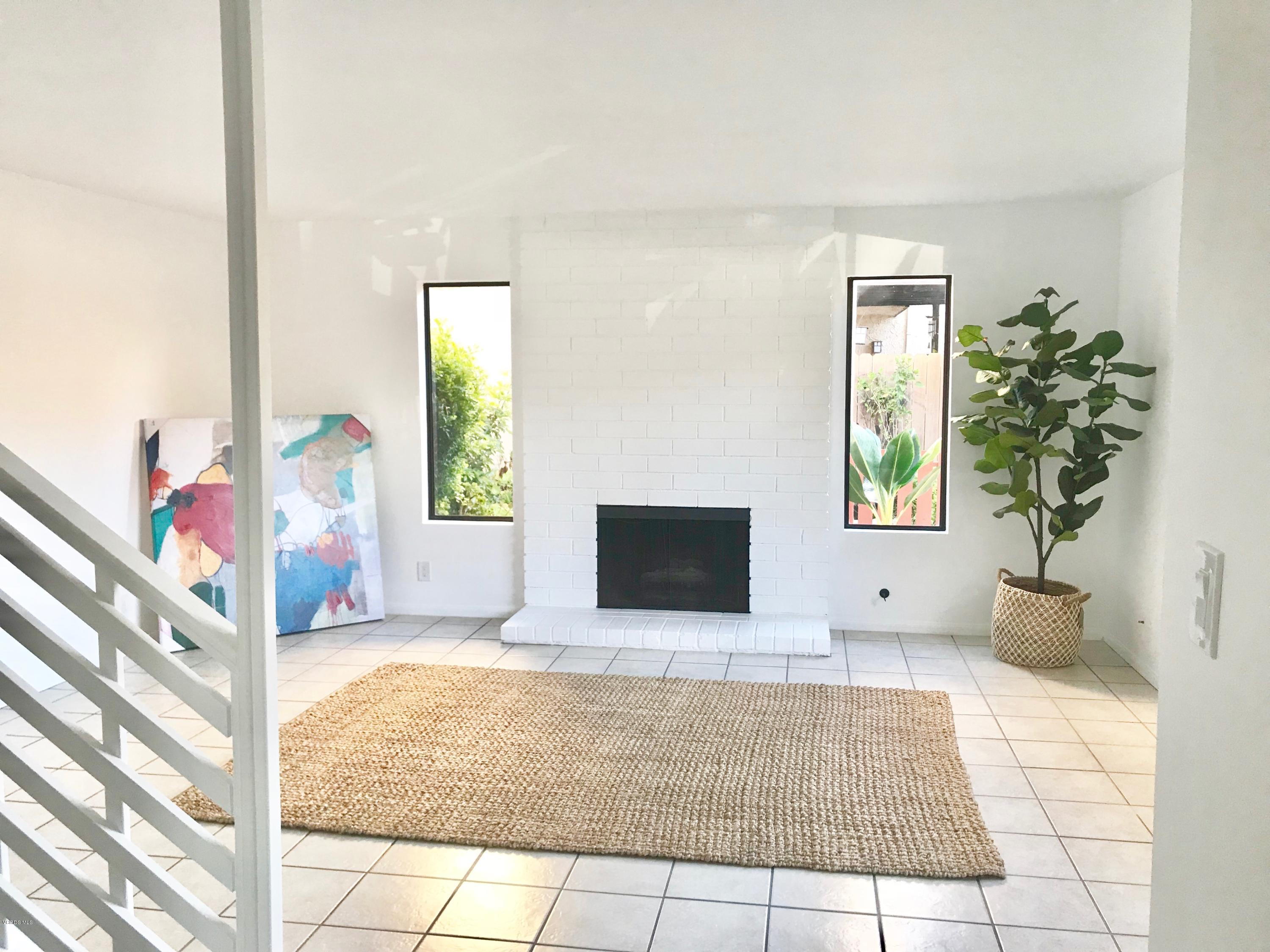 5205 West Wooley Road, Unit 1 Oxnard, CA 93035 - Photo 4 of 21 a living room with furniture and a potted plant