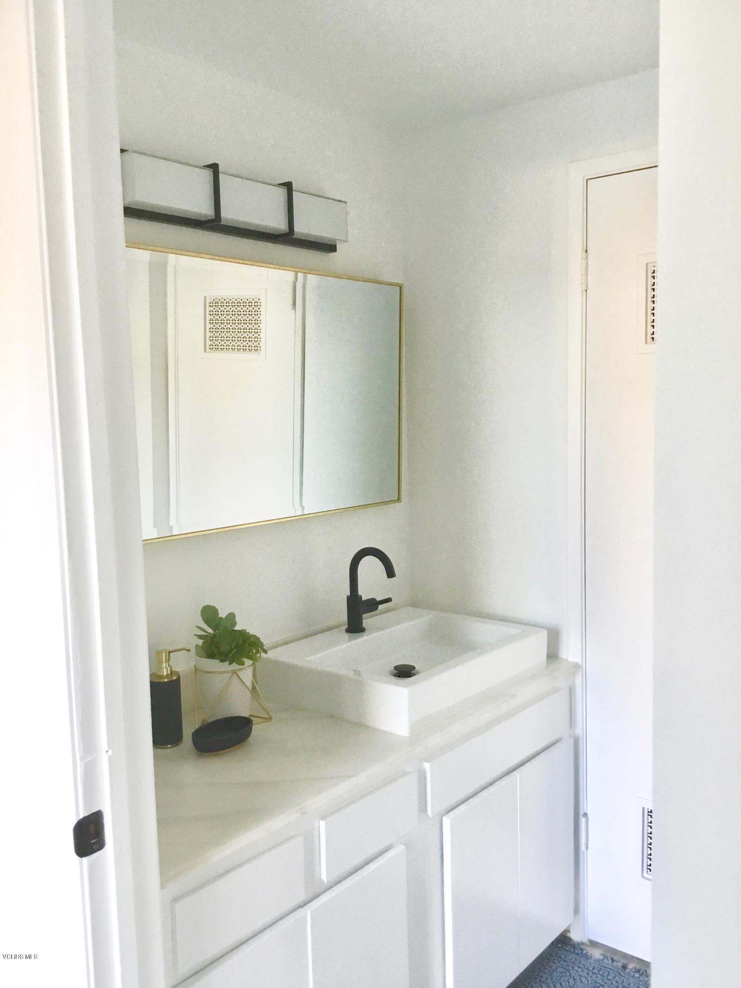 5205 West Wooley Road, Unit 1 Oxnard, CA 93035 - Photo 9 of 21 a kitchen with a sink and cabinets