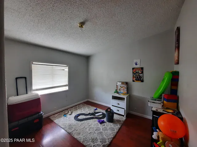 a room with furniture and wooden floor