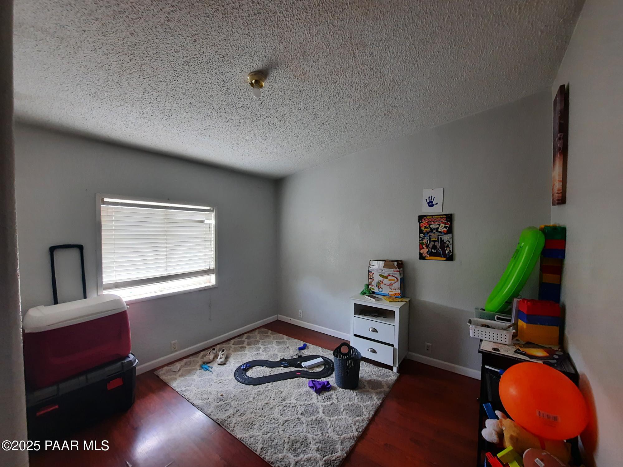 61333 Rough Rock Road Seligman, AZ 86337 - Photo 15 of 34 a room with furniture and wooden floor
