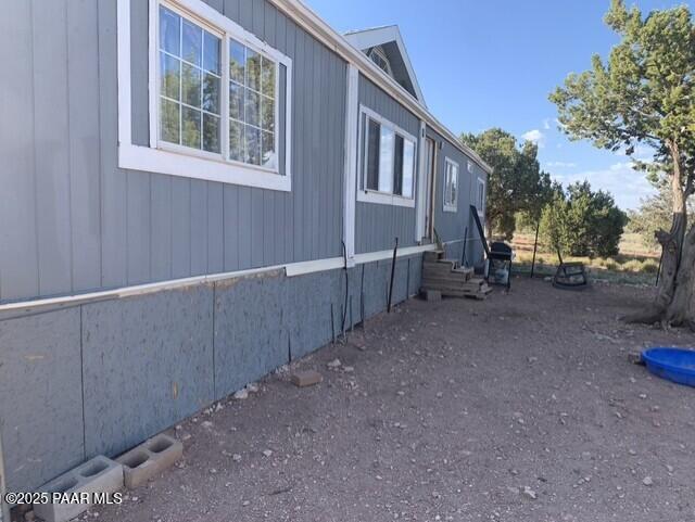 61333 Rough Rock Road Seligman, AZ 86337 - Photo 3 of 34 a view of a house with backyard and trees