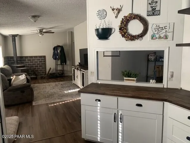 a kitchen with a refrigerator and a stove