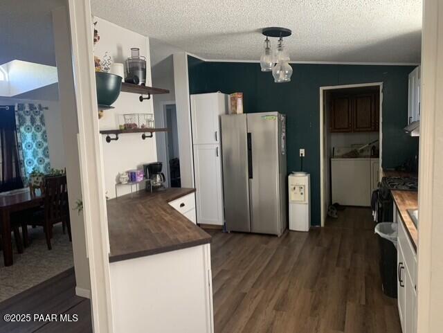 61333 Rough Rock Road Seligman, AZ 86337 - Photo 7 of 34 a view of a kitchen with refrigerator and wooden floor