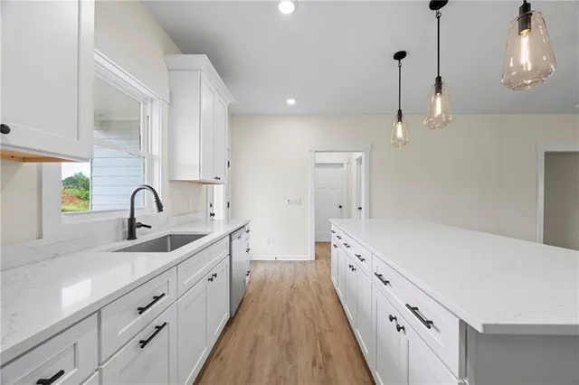 a spacious bathroom with a double vanity sink a and a shower