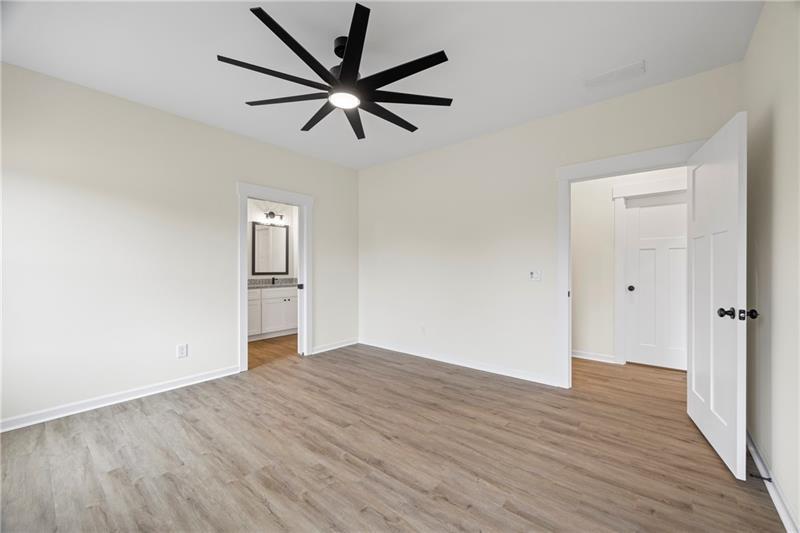 633 Racetrack Road Toccoa, GA 30577 - Photo 24 of 37 an empty room with wooden floor and windows