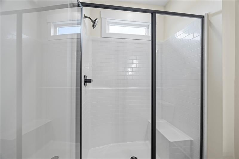 633 Racetrack Road Toccoa, GA 30577 - Photo 28 of 37 a bathroom with a glass shower door