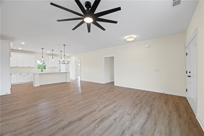 633 Racetrack Road Toccoa, GA 30577 - Photo 6 of 37 wooden floor in an empty room with a kitchen