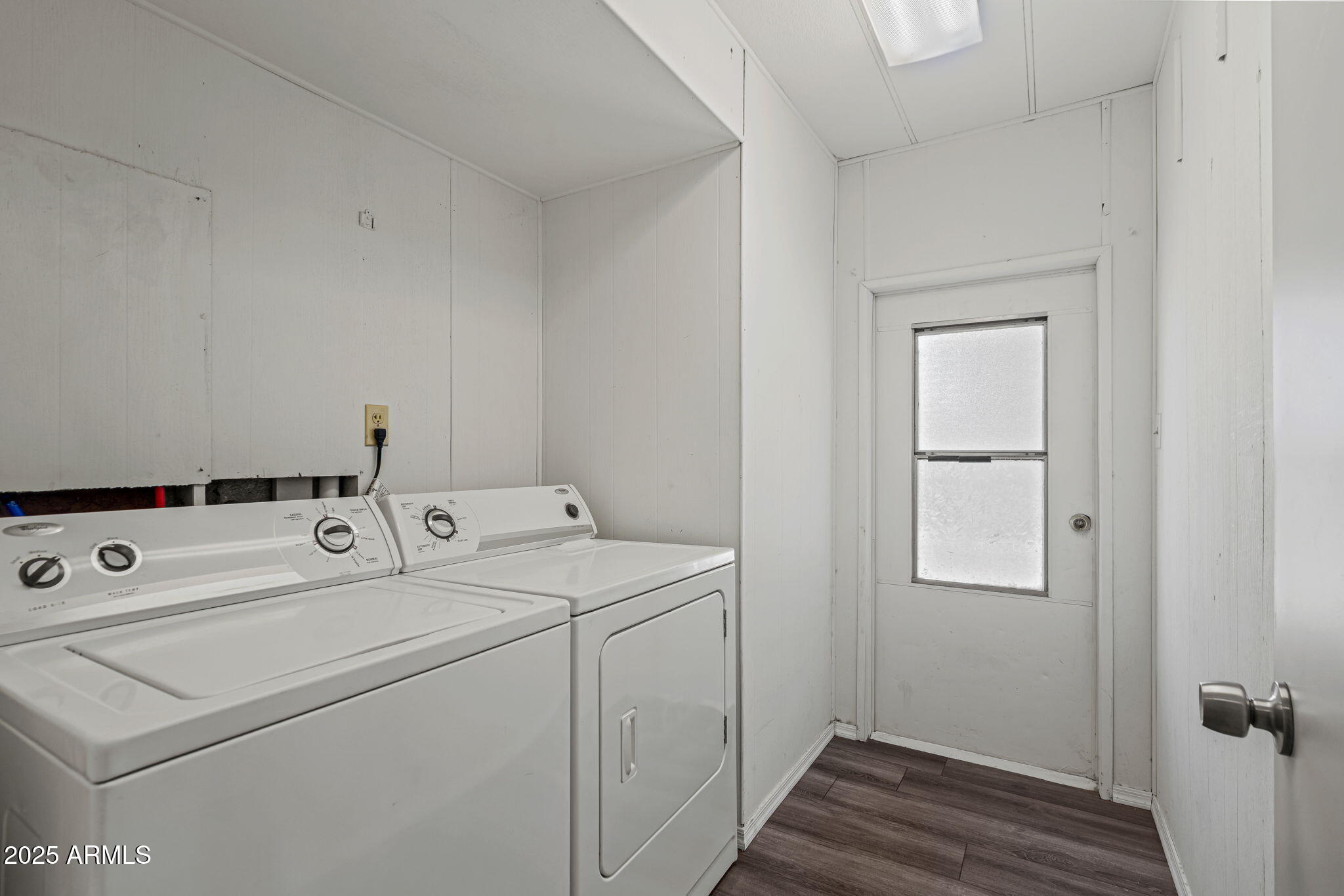 201 South Greenfield Road, Unit 207 Mesa, AZ 85206 - Photo 11 of 50 a view of washer and dryer with bathroom in the background