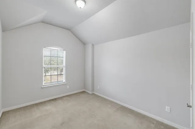 an empty room with a bathroom