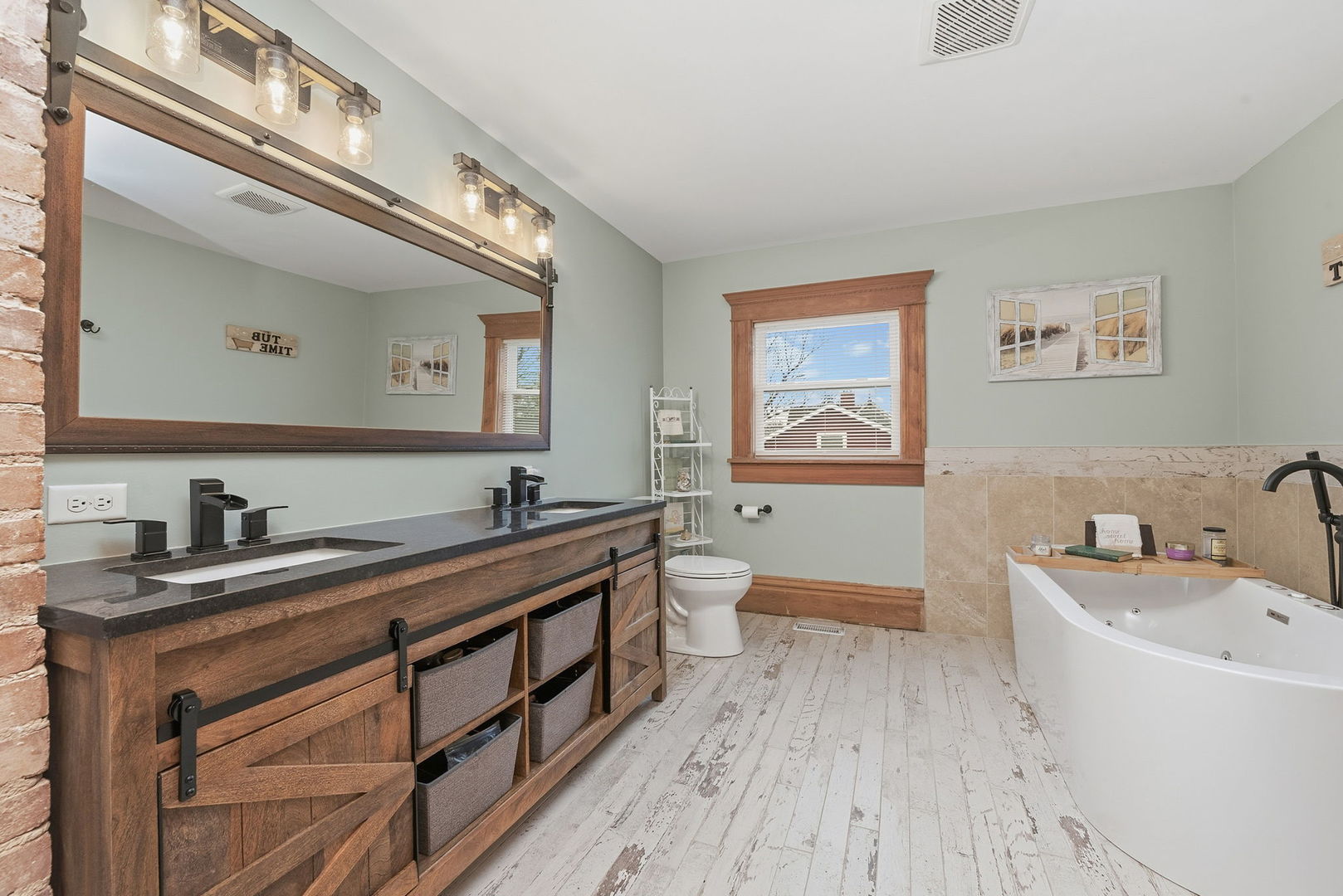 410 West Reader Street Elburn, IL 60119 - Photo 11 of 19 a spacious bathroom with a granite countertop sink a large mirror a toilet and bathtub