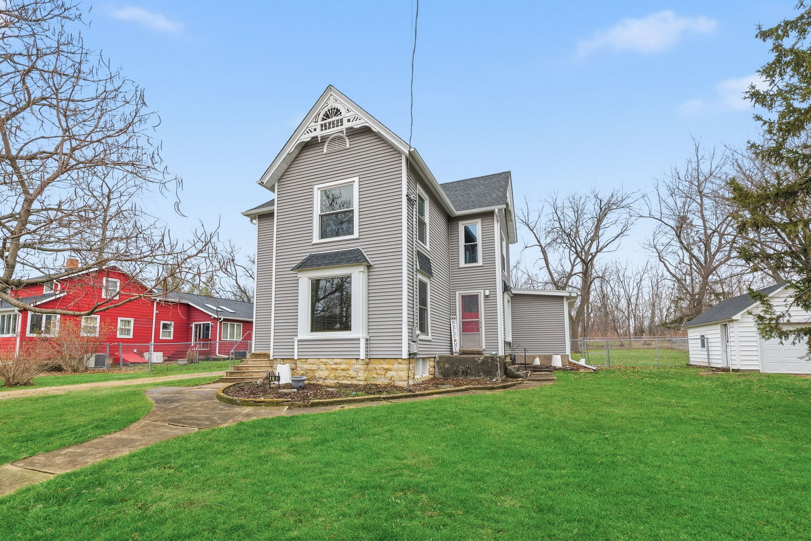 410 West Reader Street Elburn, IL 60119 - Photo 18 of 19 a front view of house with yard and green space