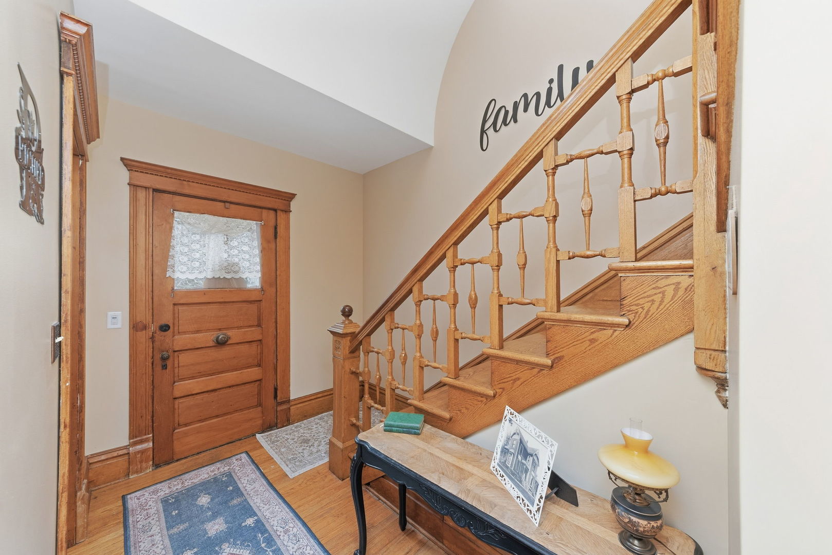 410 West Reader Street Elburn, IL 60119 - Photo 2 of 19 a living room with wooden floor and stairs