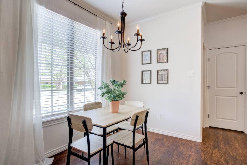 3107 33rd Street, Unit 1 Lubbock, TX 79410 - Photo 15 of 22 a view of a dining room with furniture and wooden floor