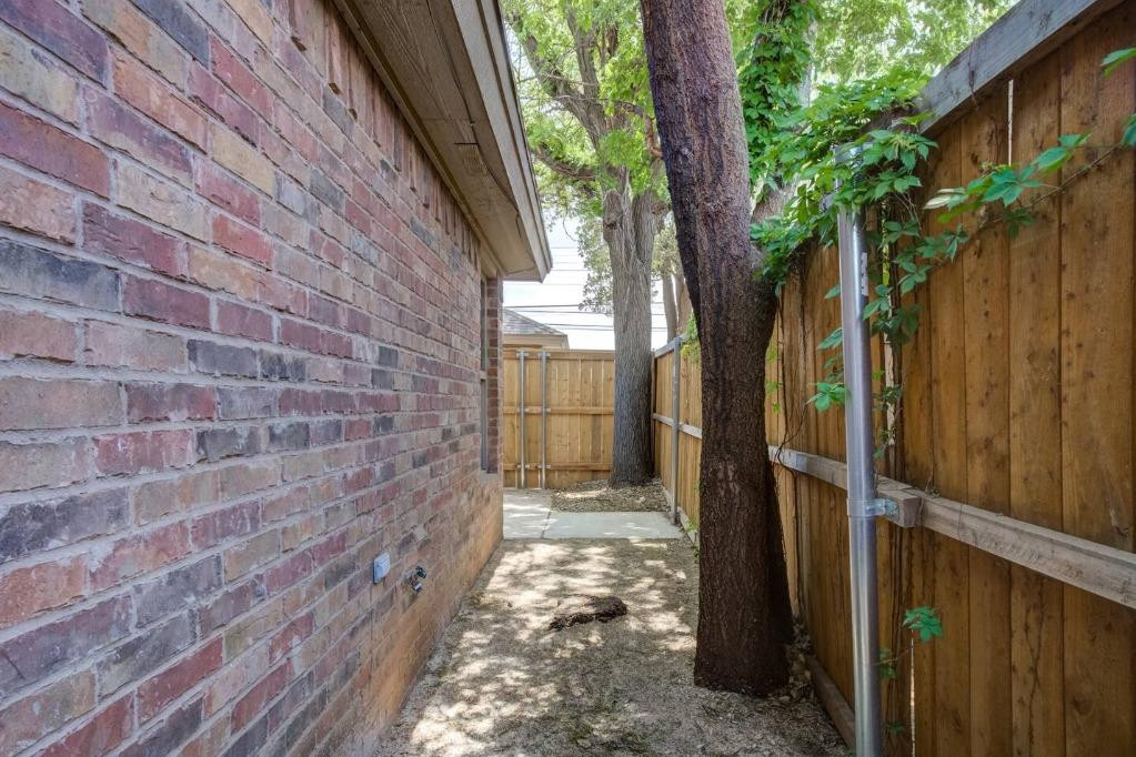 3107 33rd Street, Unit 1 Lubbock, TX 79410 - Photo 21 of 22 a view of a pathway with a house