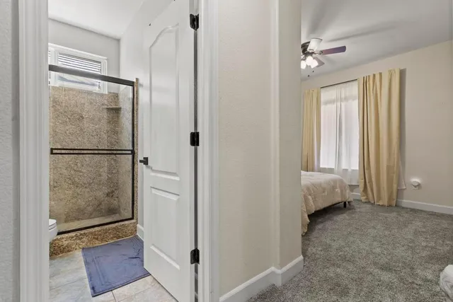 a bathroom with a tub and shower