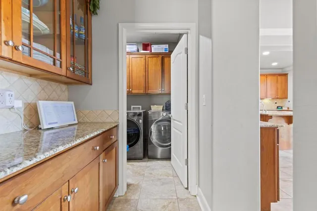 a kitchen with a refrigerator and a sink