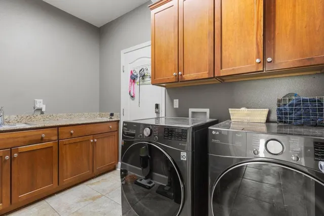 a utility room with dryer and washer