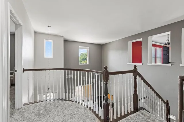 a view of a hallway with windows