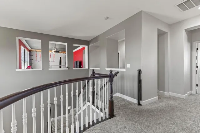 a view of a hallway with windows