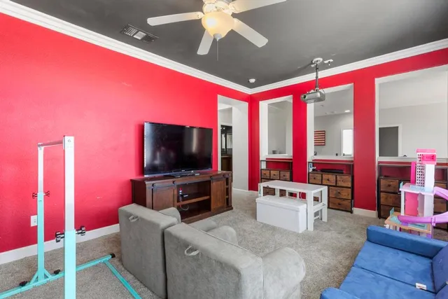 a living room with furniture and a flat screen tv