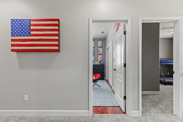 a room with cabinets and wooden floor