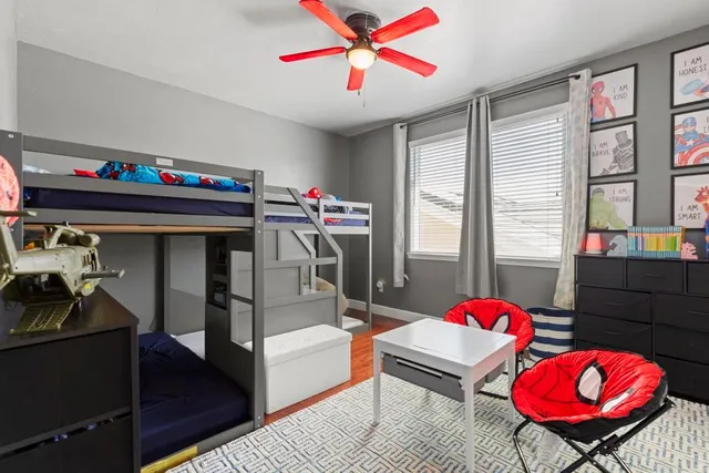 a bathroom with a granite countertop sink double vanity and a mirror