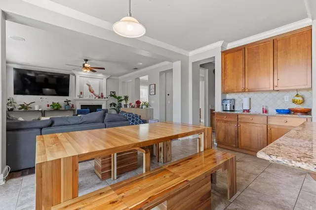 a large kitchen with stainless steel appliances granite countertop a lot of counter space and wooden floor
