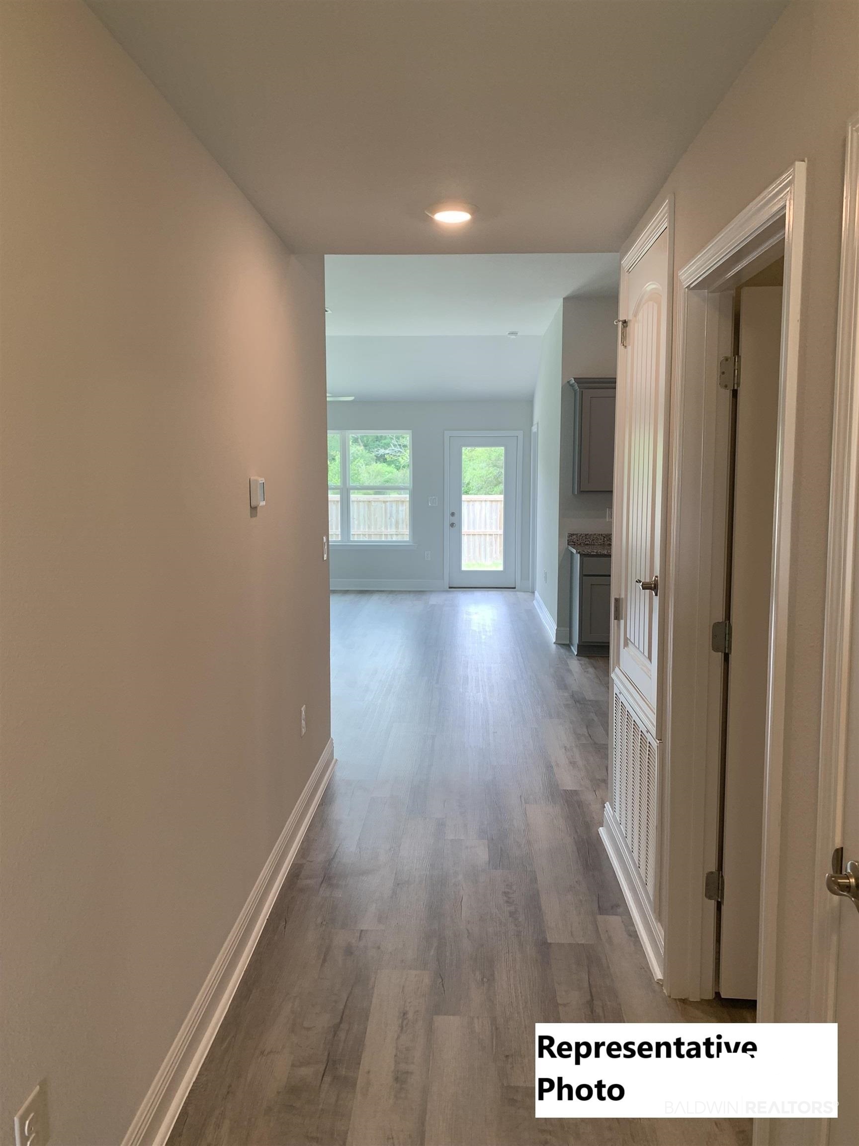 645 Revere Street Foley, AL 36535 - Photo 2 of 14 Hallway featuring hardwood / wood-style flooring