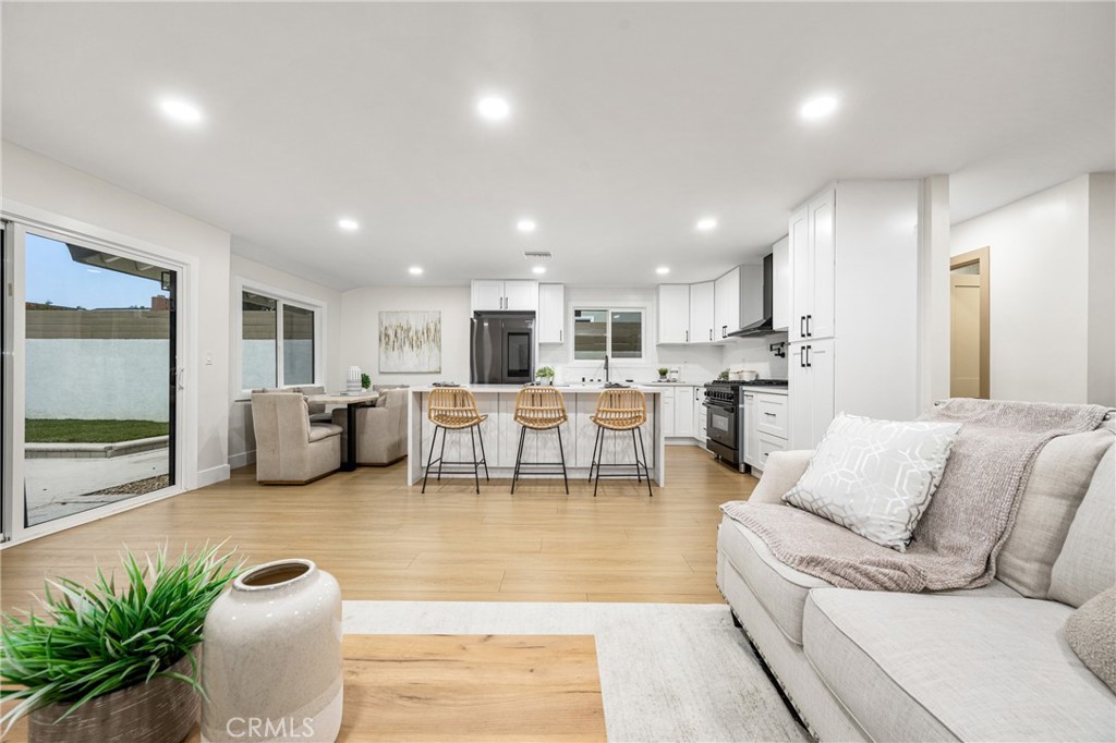3660 Pioneer Boulevard Long Beach, CA 90808 - Photo 15 of 50 a living room with furniture kitchen view and a large window