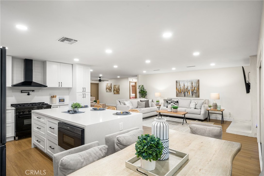 3660 Pioneer Boulevard Long Beach, CA 90808 - Photo 2 of 50 a living room with stainless steel appliances kitchen island granite countertop a couch and a view of living room