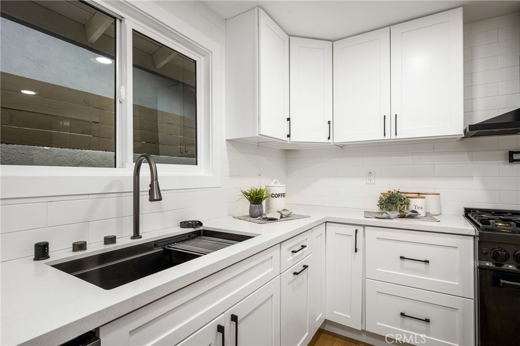 3660 Pioneer Boulevard Long Beach, CA 90808 - Photo 22 of 50 a kitchen with a sink and cabinets
