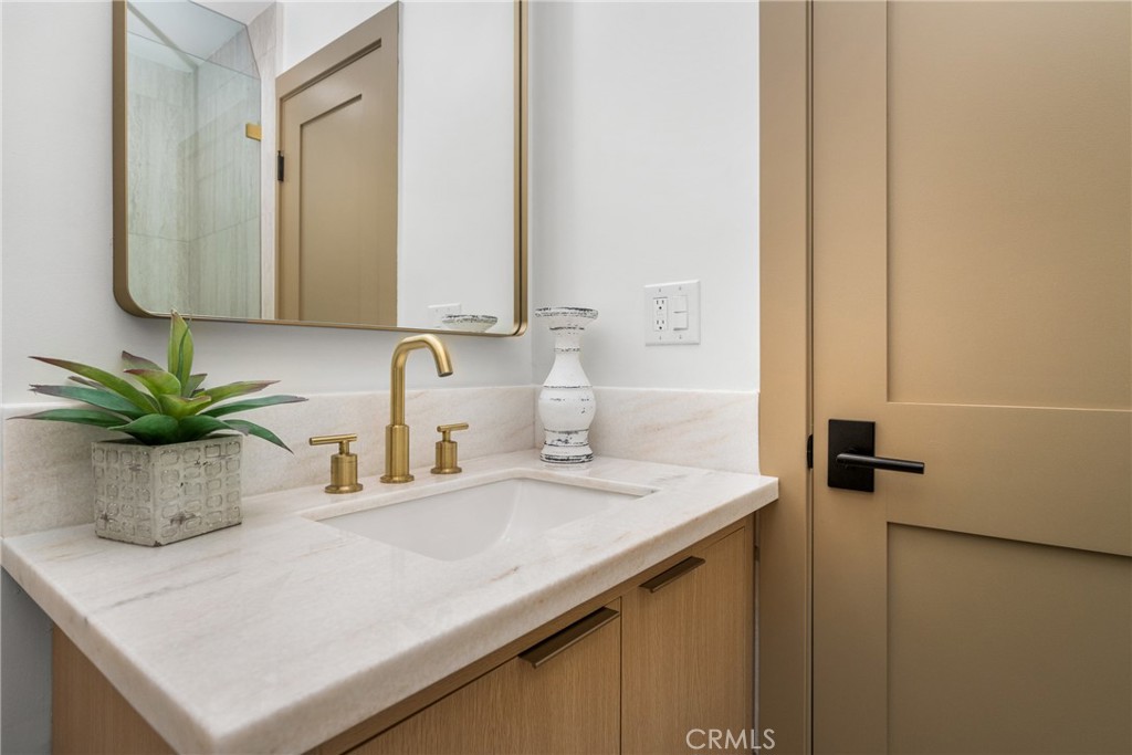 3660 Pioneer Boulevard Long Beach, CA 90808 - Photo 33 of 50 a bathroom with a sink and a mirror