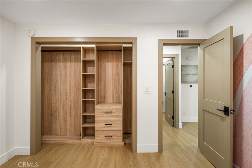 3660 Pioneer Boulevard Long Beach, CA 90808 - Photo 37 of 50 wooden floor and closet in a room